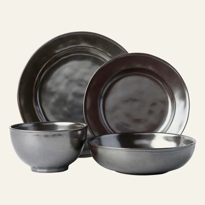 Juliska Pewter stoneware four-piece place setting with glazed charcoal finish.