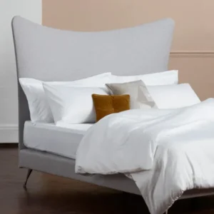 The Dream 300 white bed linen set photographed with the grey Amelia headboard