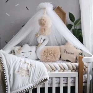 Beige baby crib bedding with braided crib bumper. KARI studio